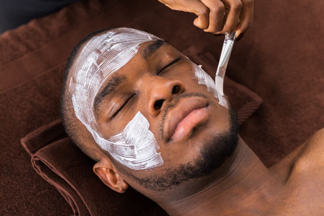 A man receiving a facial rejuvenation treatment.