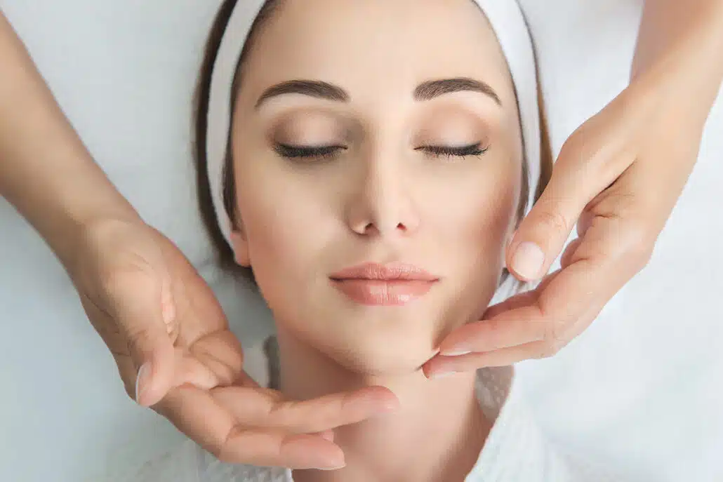 Young woman receiving a facial treatment in New Jersey.