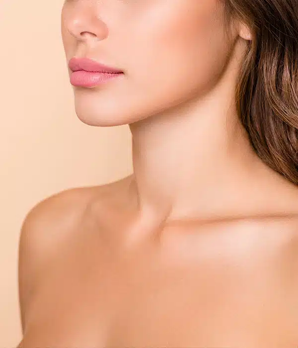 Picture of a female patient showcasing the neck area in relation to plastic surgery incisions.