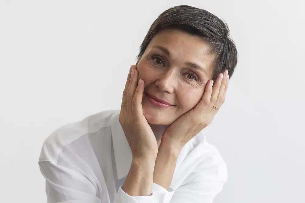 A part of the Silhouette InstaLift procedure involving the suture placement into a patient's facial skin, performed by a double board-certified cosmetic surgeon.