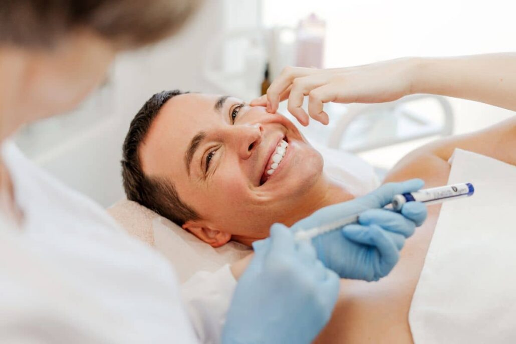 Man receiving Botox injection in cheek at cosmetic clinic, highlighting Brotox treatment results and duration