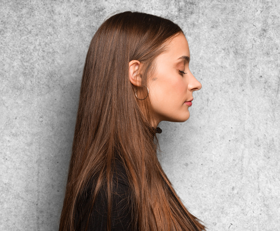 Side profile of woman showing natural nose shape and smooth contours related to rhinoplasty expectations
