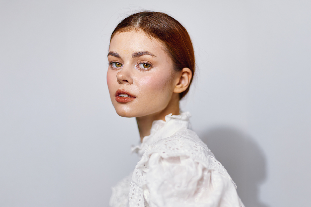 Woman with clearer, smoother skin after acne scar treatment improving overall complexion