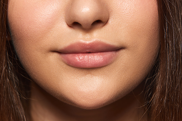 Enhanced chin projection improving jawline definition and overall facial balance after chin augmentation.