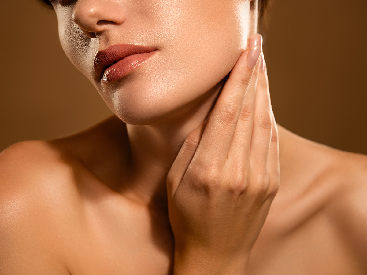 Close-up of jawline and chin highlighting areas treated with facial liposuction for improved contour.