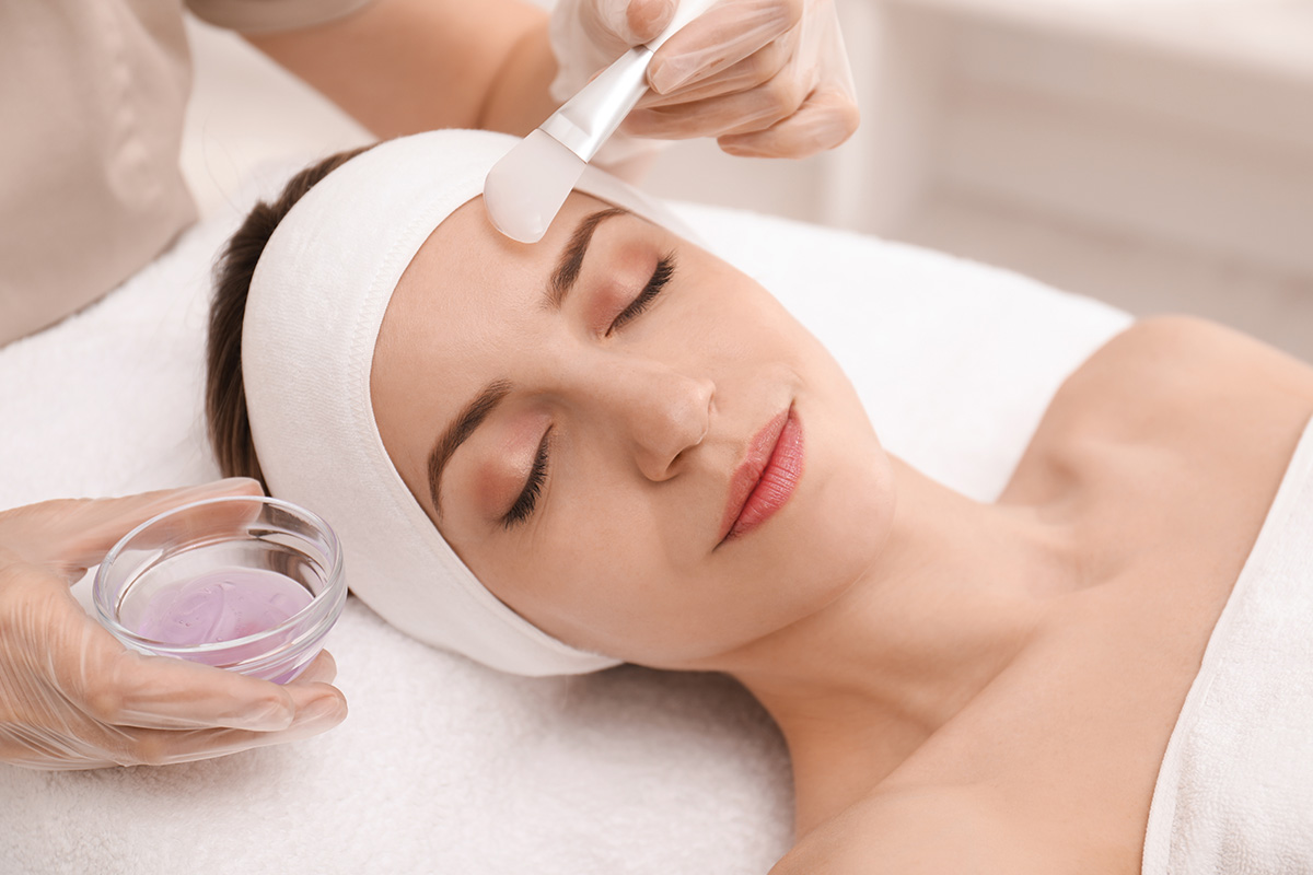Hydrating smoothing facial applying gel mask to soothe and moisturize dry sensitive skin.