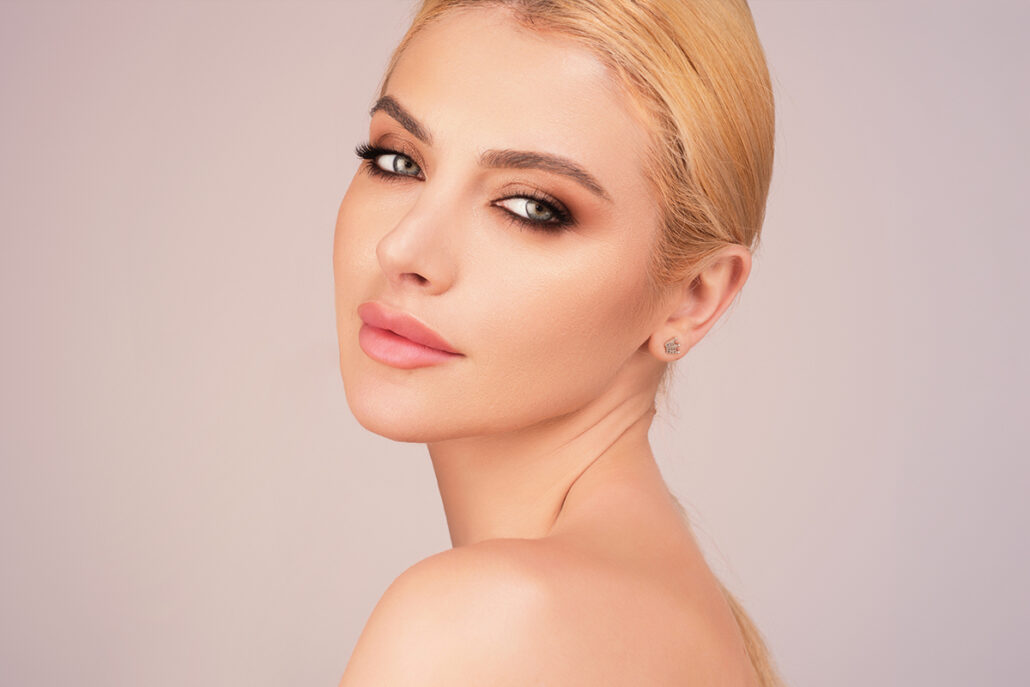 Woman with clear healthy eyes highlighting safe use of Latisse and proper eyelid care