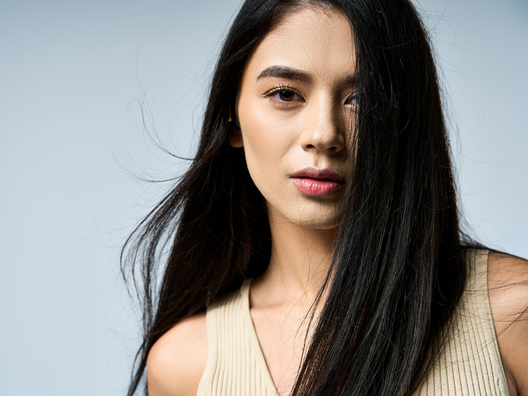Woman with clear skin representing SkinPen microneedling safety, minimal risks, and healthy skin after treatment