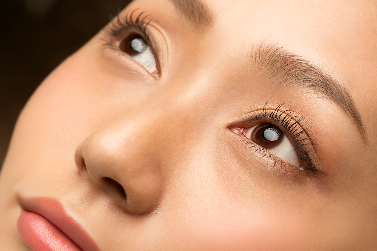 Close-up of refined nose and smooth contours after rhinoplasty procedure improving facial balance