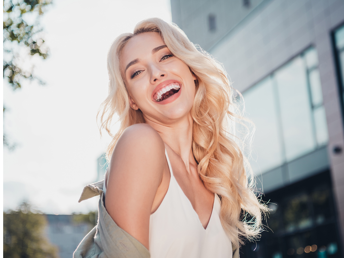 Smiling woman representing professional skin care products and skincare consultation services in New Jersey.