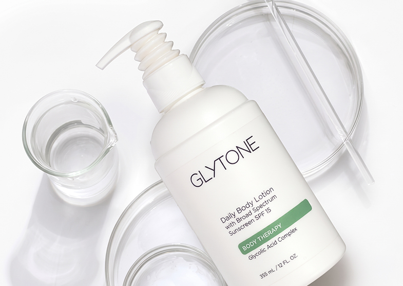 Glytone body lotion bottle representing glycolic acid skincare for rough skin, keratosis pilaris, and ingrown hairs.