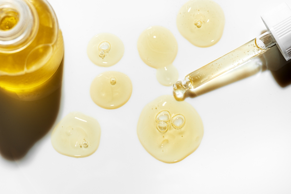 Exosomes quick facts beside skincare serum drops for collagen, elastin, and gradual skin renewal.
