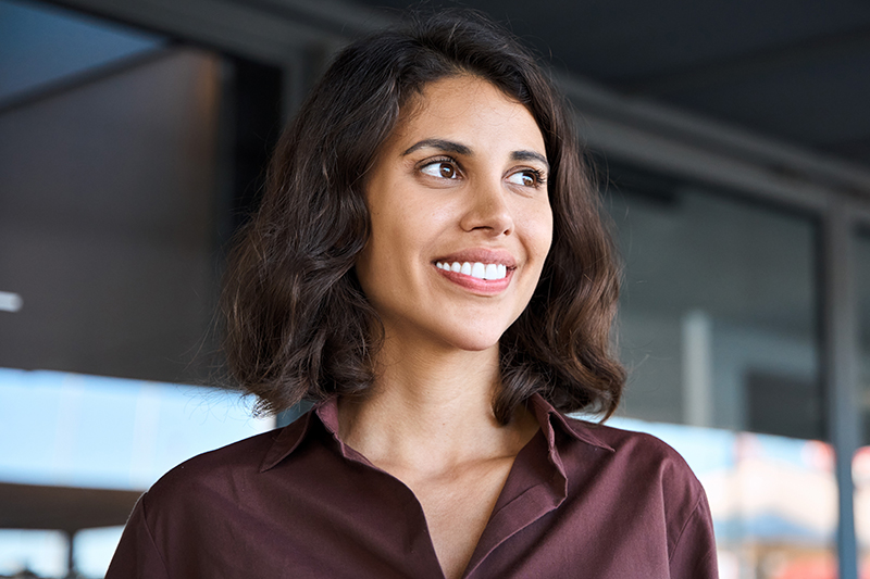 Smiling woman representing facelift with neck lift for balanced facial and neck rejuvenation.