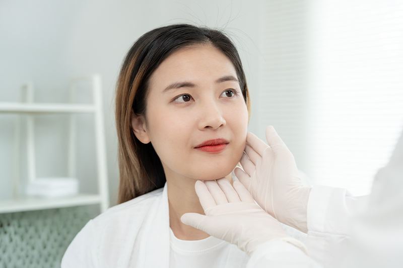 Patient during nasal evaluation for functional rhinoplasty and breathing-related nasal concerns.