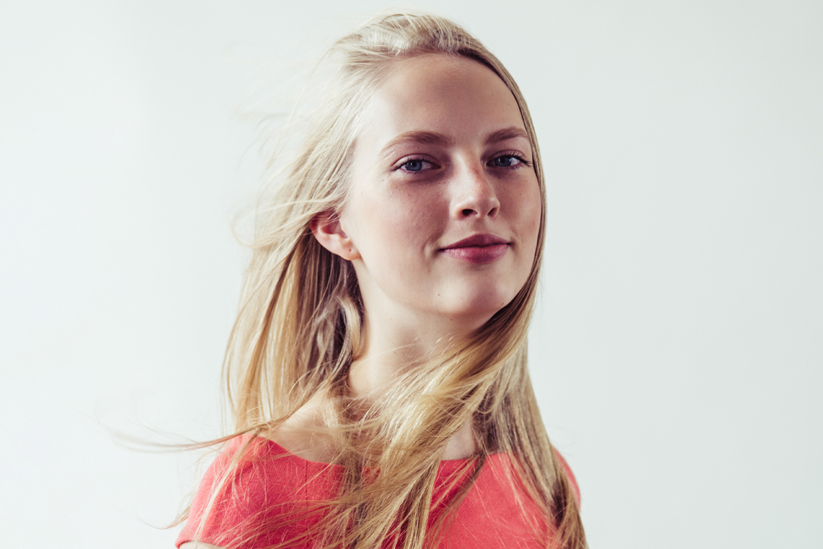 Young woman with natural facial features representing ideal rhinoplasty candidates and subtle refinement goals.