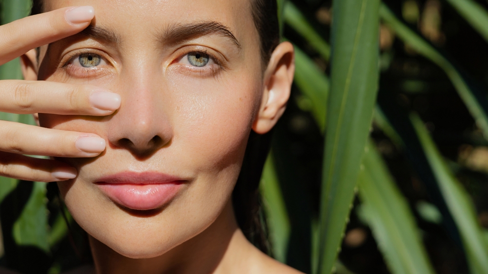 Woman with clear skin beside PRP recovery and aftercare tips for low downtime after treatment.