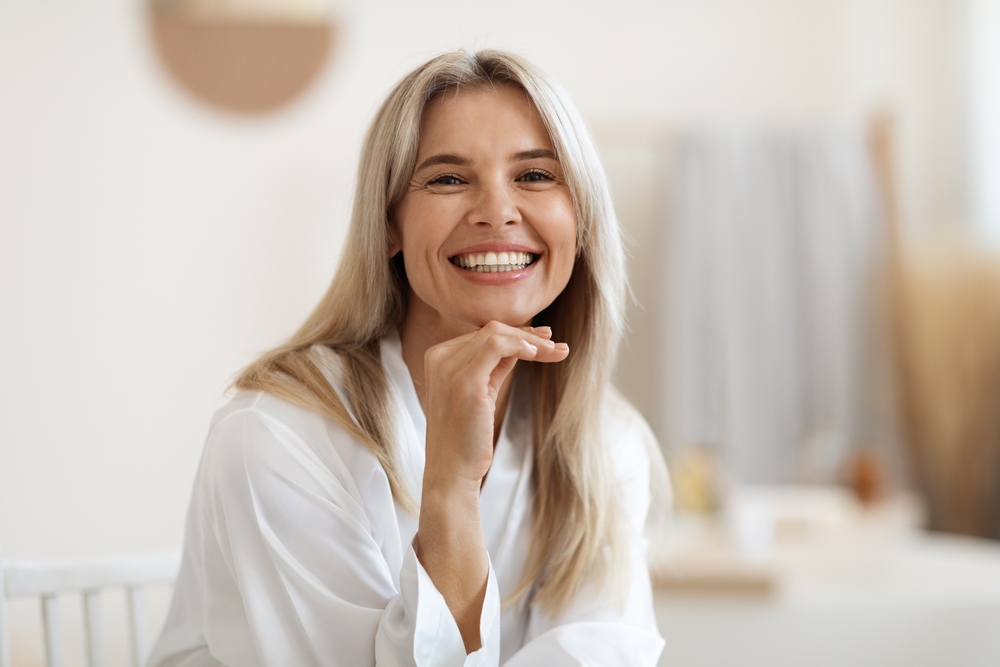 Smiling woman beside fractional CO2 recovery tips for peeling, aftercare, SPF, and collagen remodeling.