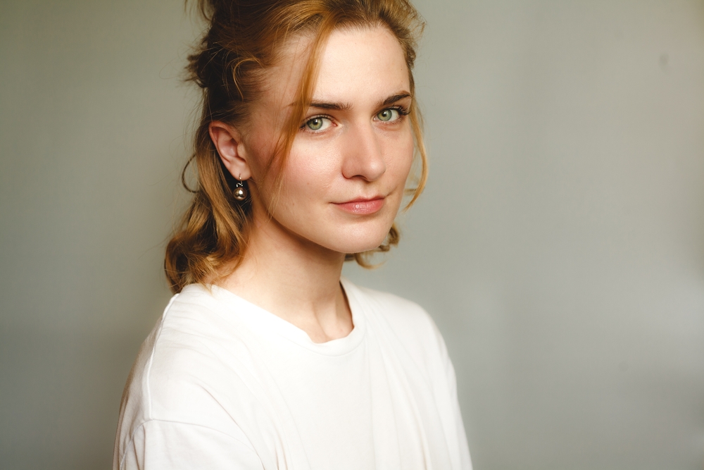 Woman beside scar formation content explaining collagen repair, raised scars, sunken acne scars, and healing differences.